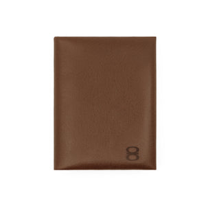 Draft8 brown foldable cardholder made of vegetable-tanned leather, front view with embossed logo

