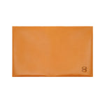 Load image into Gallery viewer, Back view of Draft8 folded camel wallet made from vegetable-tanned leather, showcasing minimalist craftsmanship and premium natural finish



