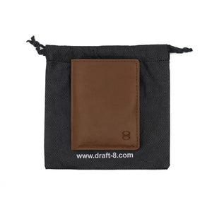 Brown Draft-8 leather wallet inside black fabric packaging pouch with visible brand logo.
