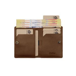 Open brown Draft-8 leather wallet displaying cash and multiple cards in organized compartments.
