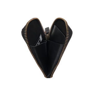 Interior view of the black leather Pop Wallet by Draft-8, unzipped to reveal compartments for cards and coins. Compact and stylish everyday carry solution.
