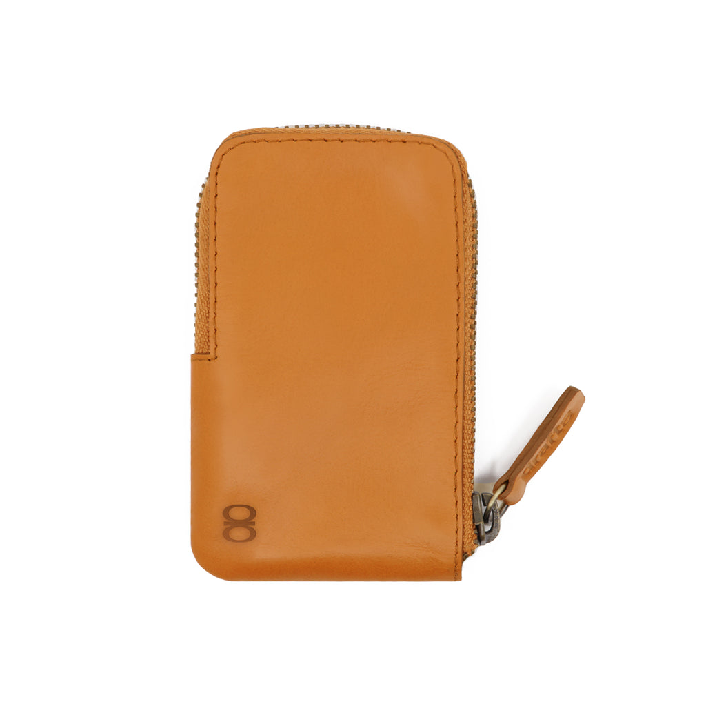 Camel-colored leather Pop Wallet by Draft-8 with a zip closure, showcasing a minimalist and compact front view design.
