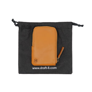 Camel Pop Wallet by Draft-8 displayed with eco-friendly black pouch packaging. Leather zip wallet ideal for cards and coins, perfect gift-ready presentation.

