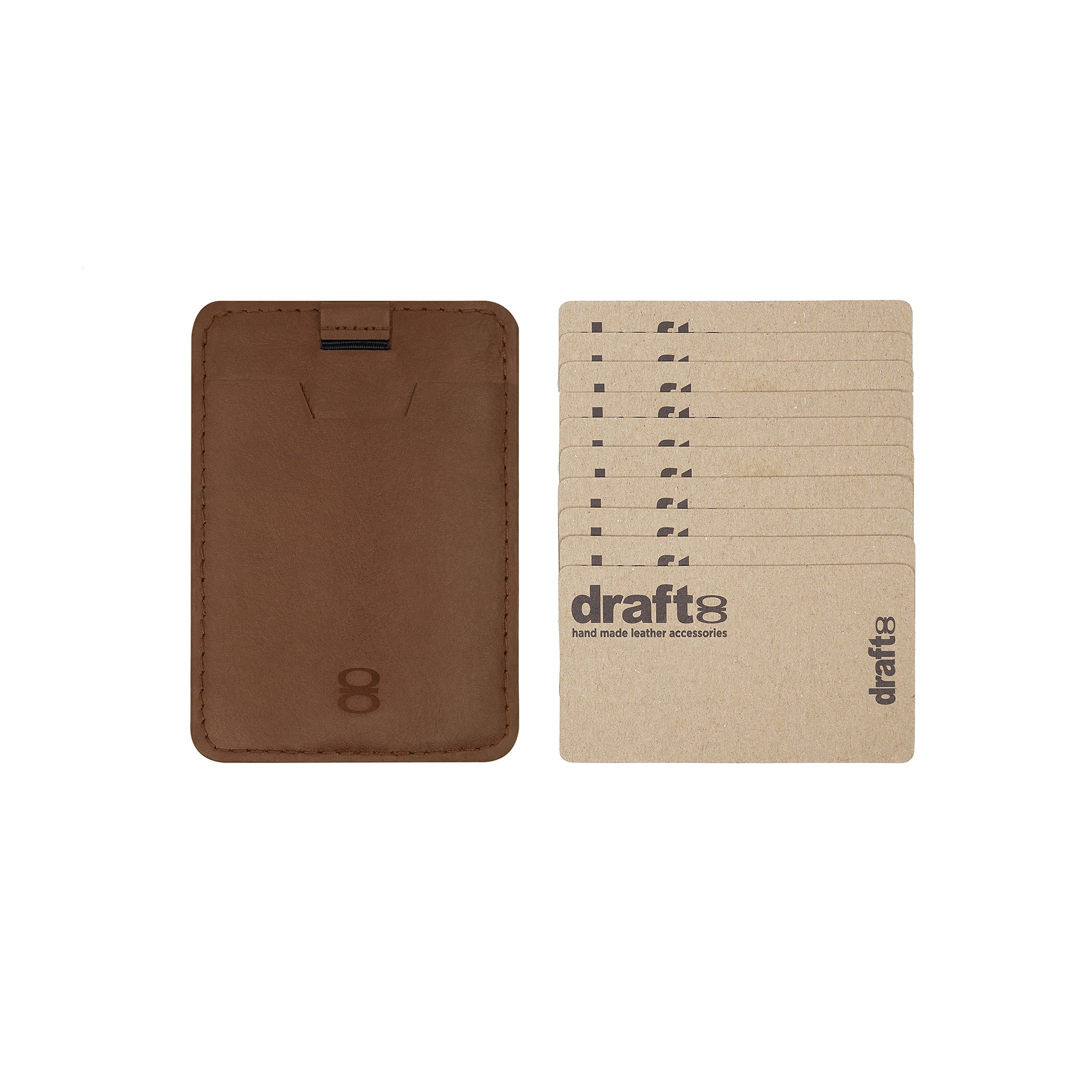 Draft-8 SIDE card holder in brown leather with sample cardboard cards. Slim RFID-blocking wallet, perfect for front pocket carry and minimal everyday use.

