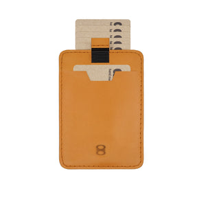 Front view of the Draft-8 SIDE card holder in camel vegetable-tanned leather, featuring inserted demo cards and pull tab system. Sleek and refined minimalist accessory by Draft-8.
