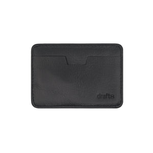 Flat view of the Draft-8 SIDE card holder in black vegetable-tanned leather. Minimalist, handcrafted accessory designed for sleek and sustainable everyday carry.

