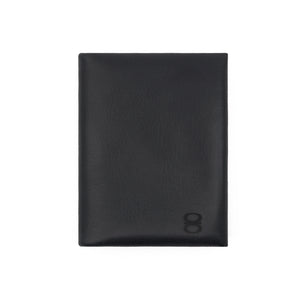 Front view of a black vegetable-tanned leather cardholder by draft-8, minimalist and refined design.