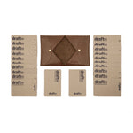 Load image into Gallery viewer, Open view of a brown vegetable-tanned leather cardholder by draft-8, displayed with cardboard sample cards
