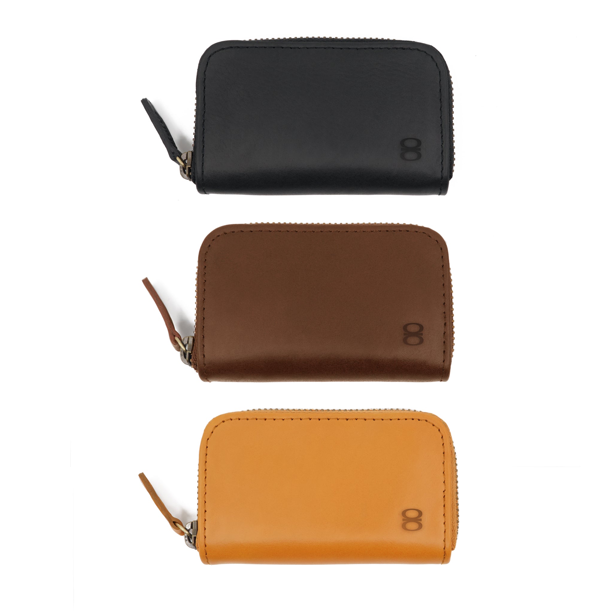 Draft-8 vegetable-tanned leather zip wallets in black, brown, and camel colors lined up vertically