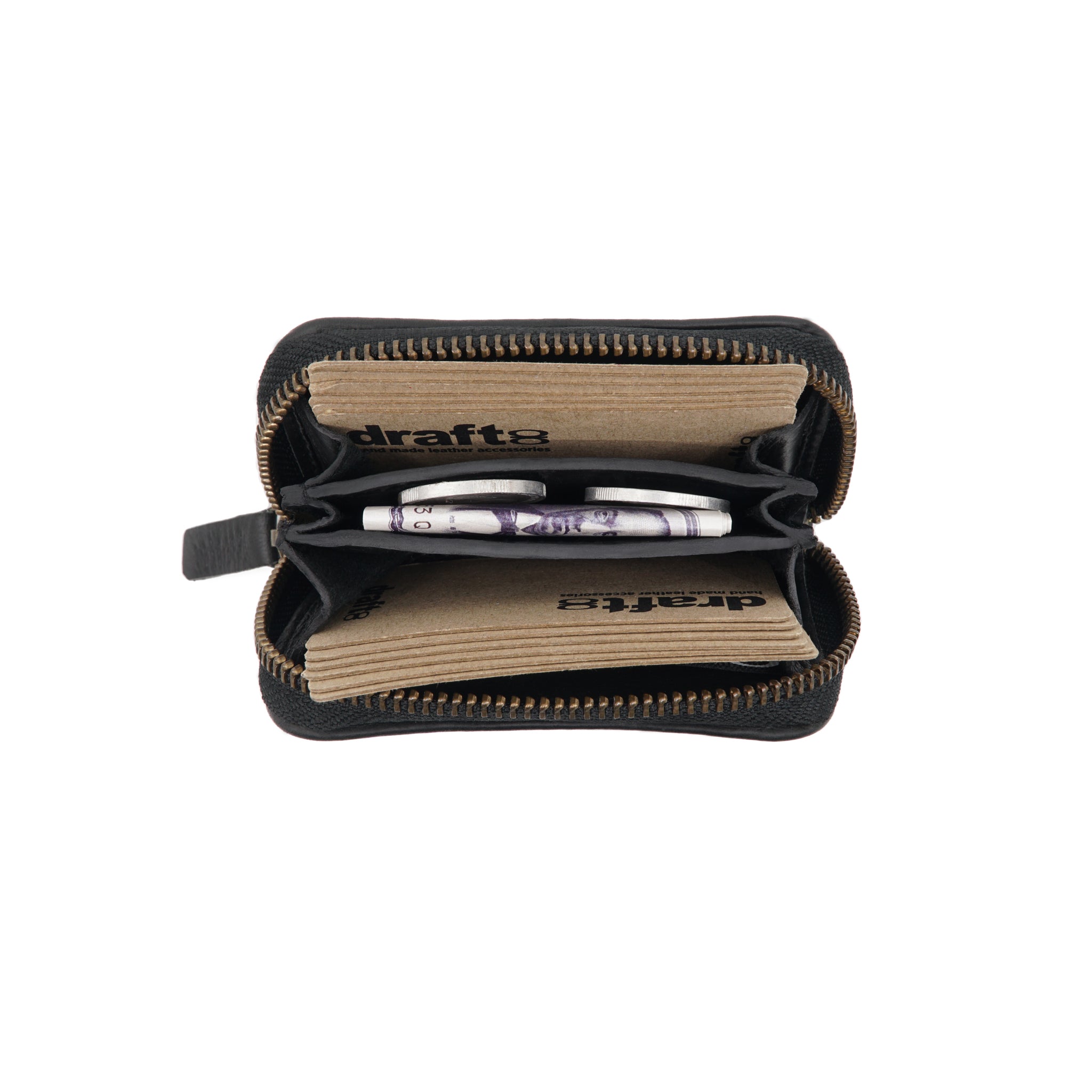 Draft-8 vegetable-tanned black leather zip wallet open with visible banknotes and inner compartments