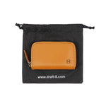 Load image into Gallery viewer, Draft-8 camel vegetable-tanned leather zip wallet presented with eco-friendly fabric pouch packaging
