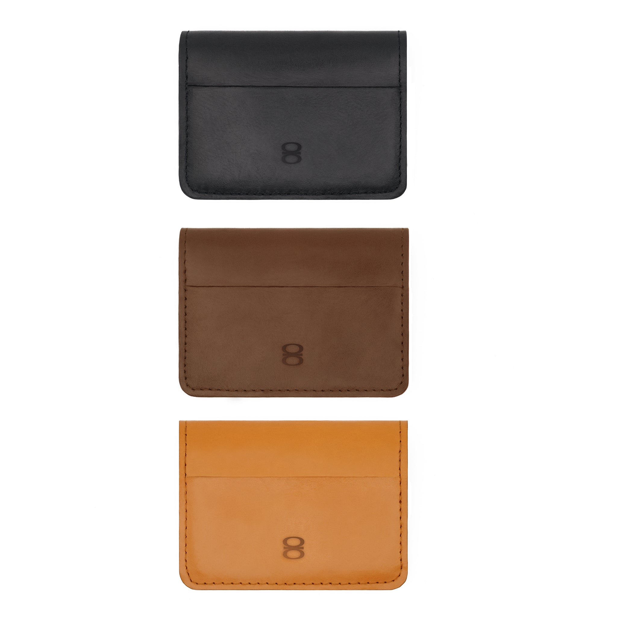 Set of three leather card holders in black, brown, and tan – minimalist wallets from Draft-8 for men and women.


