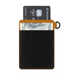 Load image into Gallery viewer, Rear view of the Draft8 cardholder with elastic black cash strap and inserted cards, designed for easy storage of notes and payment essentials.
